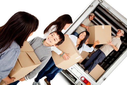 Team preparing a safe moving load for a van service