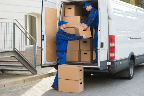 Removal team preparing a Kensington home move with boxes and furniture