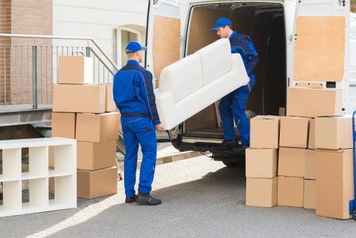 Professional packing service preparing fragile household items in Kensington