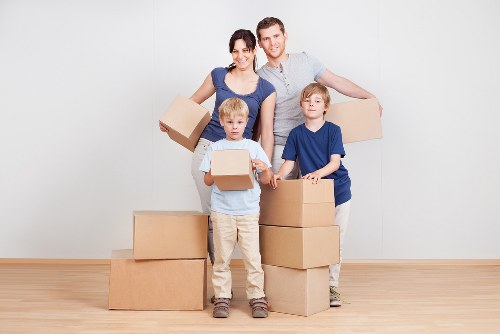 Packed boxes and moving equipment ready for a Kensington property relocation