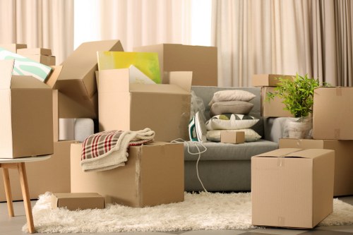 Movers using careful lifting technique during a relocation
