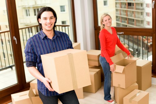 Packed moving boxes prepared for a Kensington flat relocation